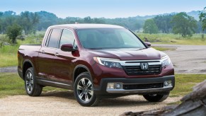 2019 Honda Ridgeline parked in sand near stream for off-roading