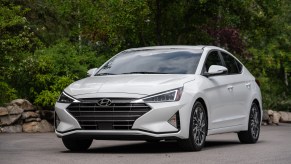 A white Hyundai Elantra on the track.