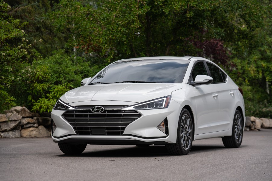 A white Hyundai Elantra on the track.