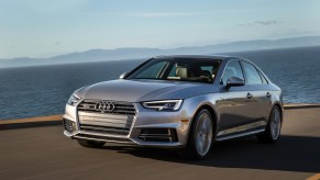 A grey 2017 Audi A4 parked near the countryside