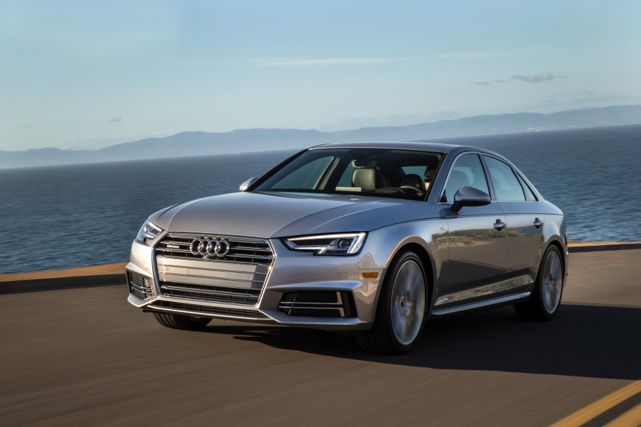 A grey 2017 Audi A4 parked near the countryside