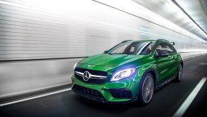 A green 2018 Mercedes-AMG GLA45 races through a tunner