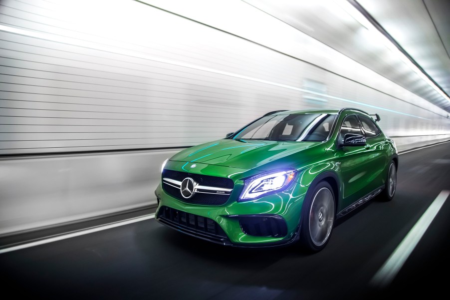 A green 2018 Mercedes-AMG GLA45 races through a tunner