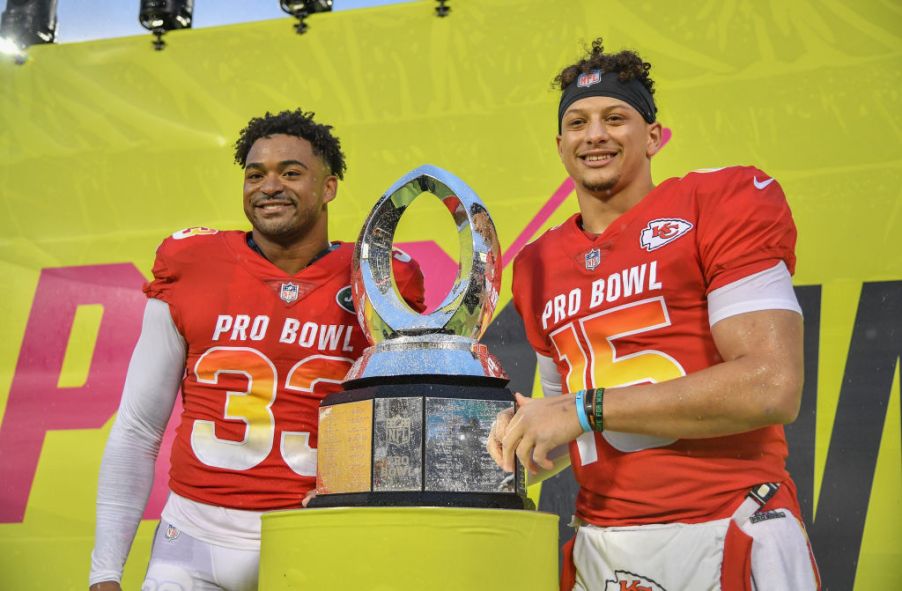 Jamal Adams and Patrick Mahomes holding the 2019 Pro Bowl MVP trophy