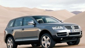 A grey Touareg SUV off-road.