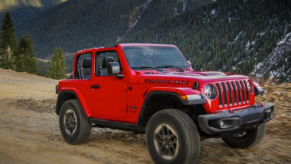 2018 Jeep Wrangler Rubicon driving down dirt road