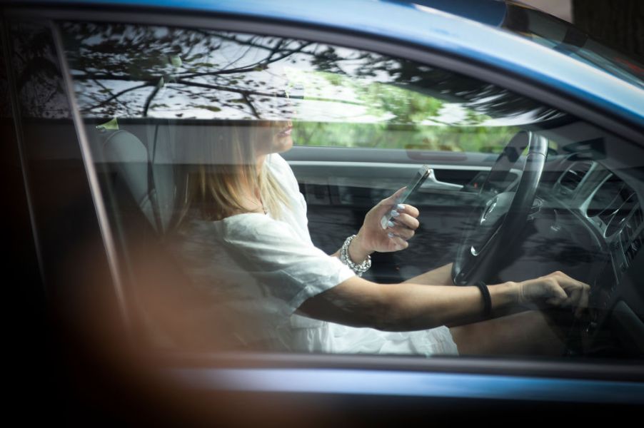 A woman in her car