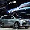 Acura MDX crossover being displayed at a motor show.