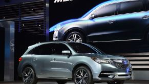 Acura MDX crossover being displayed at a motor show.