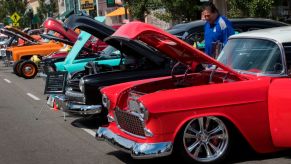 A line-up of classic cars at a car show