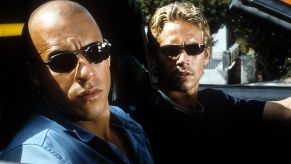 Vin Diesel And Paul Walker sitting in a car in the movie 'The Fast And The Furious'