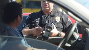 Police officer issues a speeding ticket