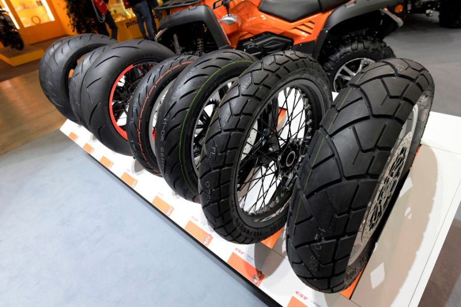 Motorcycle tires are displayed at moto show