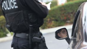 Police officer writing a traffic ticket