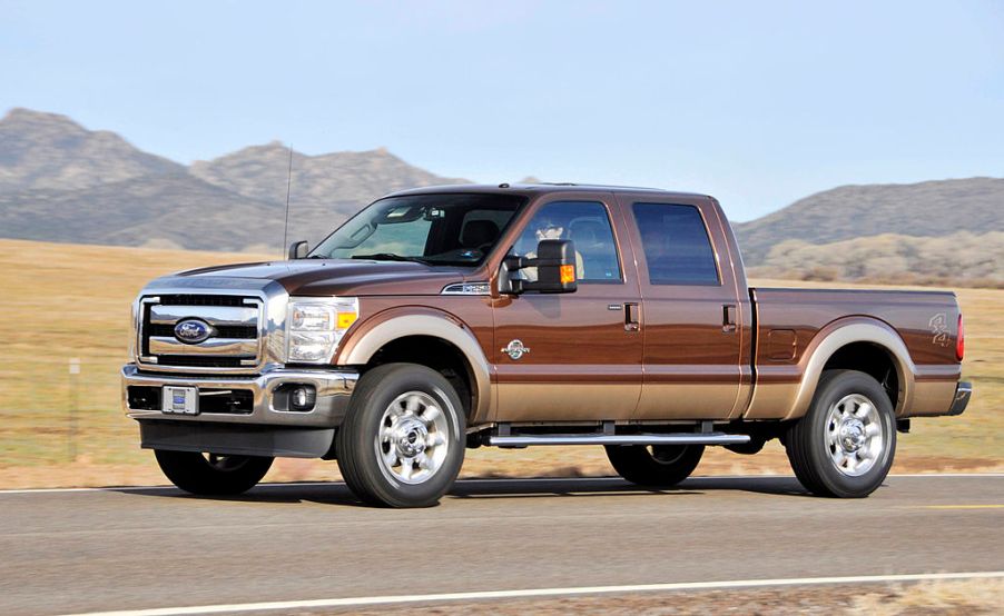 A 2011 Ford F-250 stopped on the side of a highway.