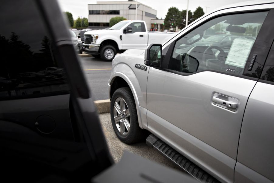 2019 Ford F-150 pickup trucks are displayed at a car dealership in Orland Park, Illinois