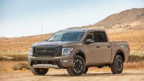 2020 Nissan TITAN PRO-4X pickup truck parked on sandy road