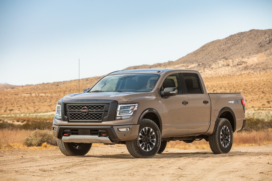 2020 Nissan TITAN PRO-4X pickup truck parked on sandy road