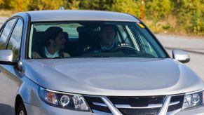 A silver car on a test drive