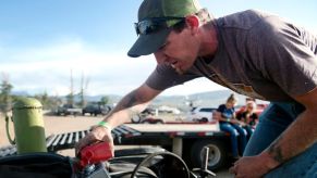 Man tops off power steering fluid