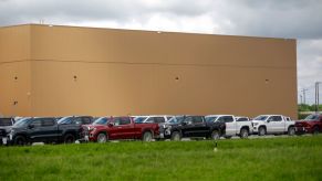 A parking lot with multiple new Chevy Silverados