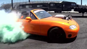 A Hellcat/Mazda Miata mashup car races away