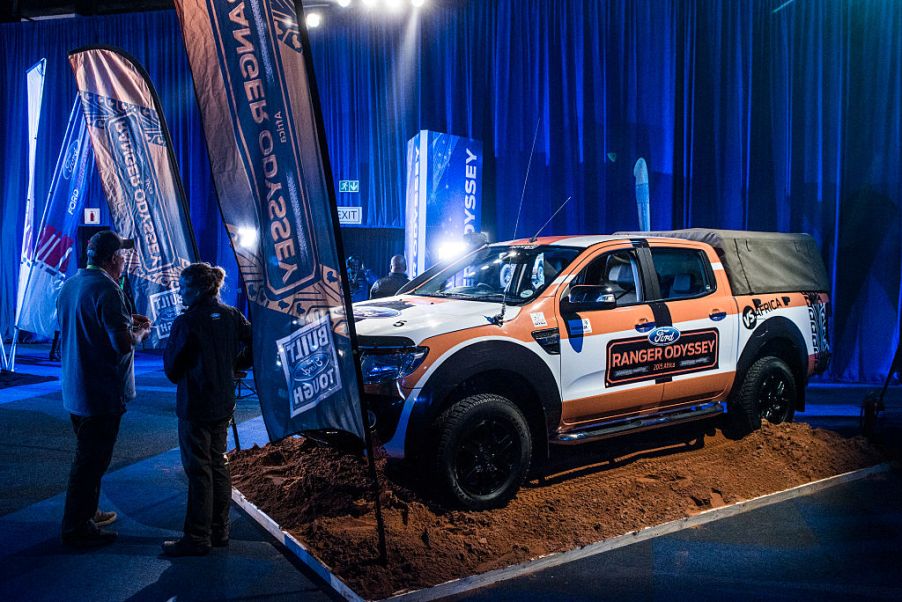 A Ford Ranger on display with a truck topper at an auto show.