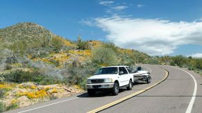 Ford SUV pulls a boat on a trailer in Arizona