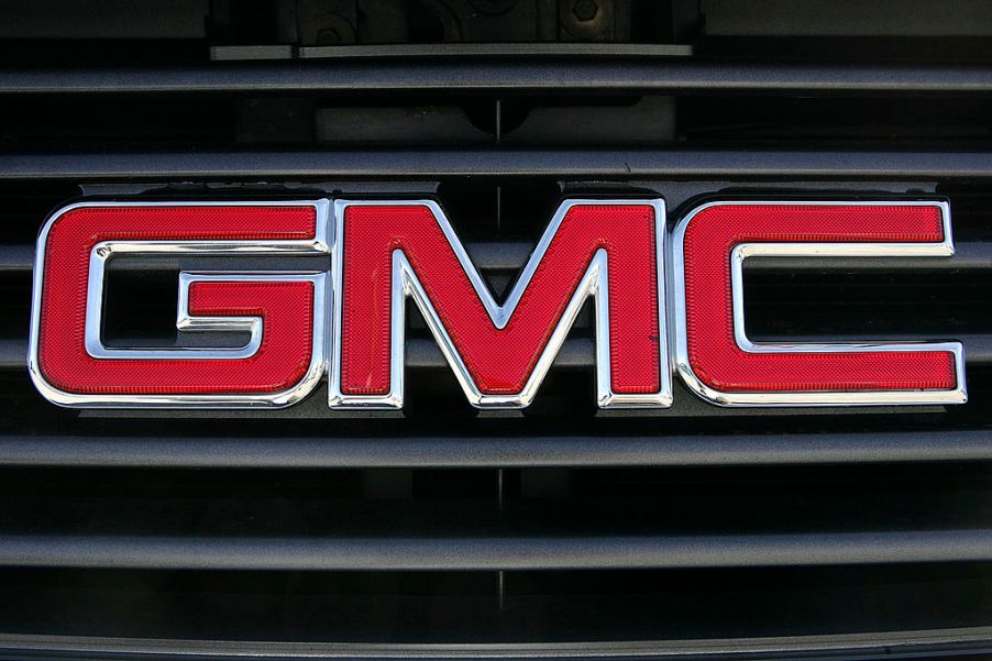 A GMC logo on the grill of a pickup truck