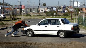 Men Pushing Car