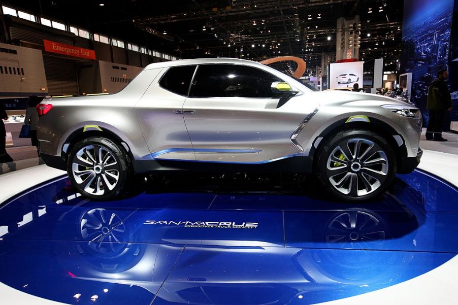 A Hyundai Santa Cruz truck on display at an auto show.