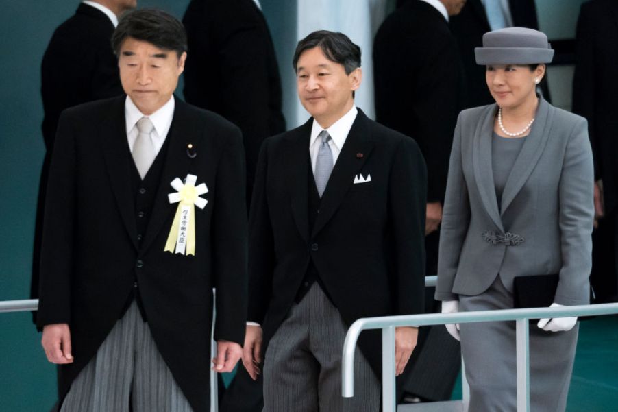 Japan's Emperor Naruhito and Empress Masako arrive for a memorial service marking the 74th anniversary of Japan's surrender in World War II