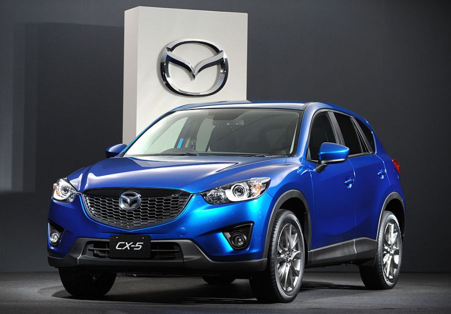 A blue Mazda CX-5 on display at a car show