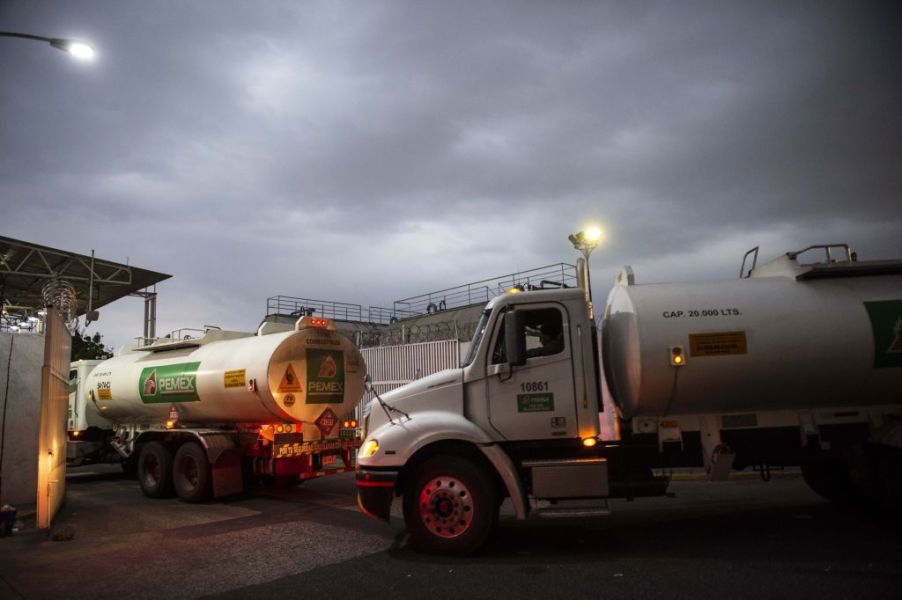 Semi-trucks fill up with fuel