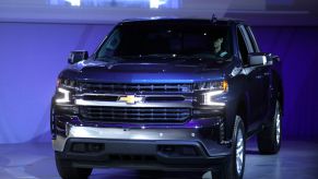 A Chevy Silverado 1500 pickup truck on display at an auto show.