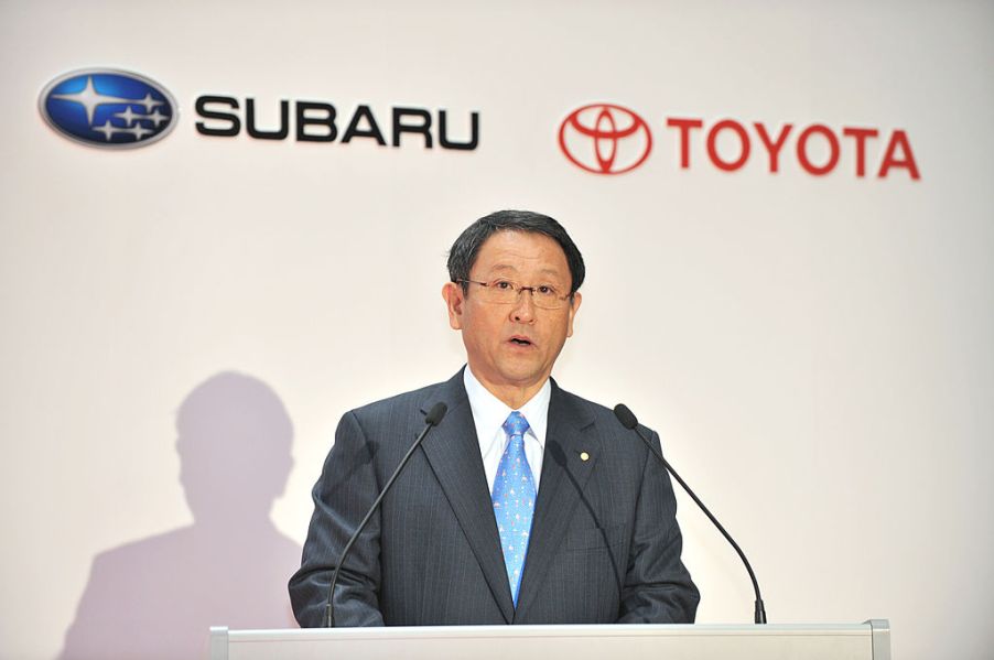 Toyota's president making an announcement about a partnership with Subaru