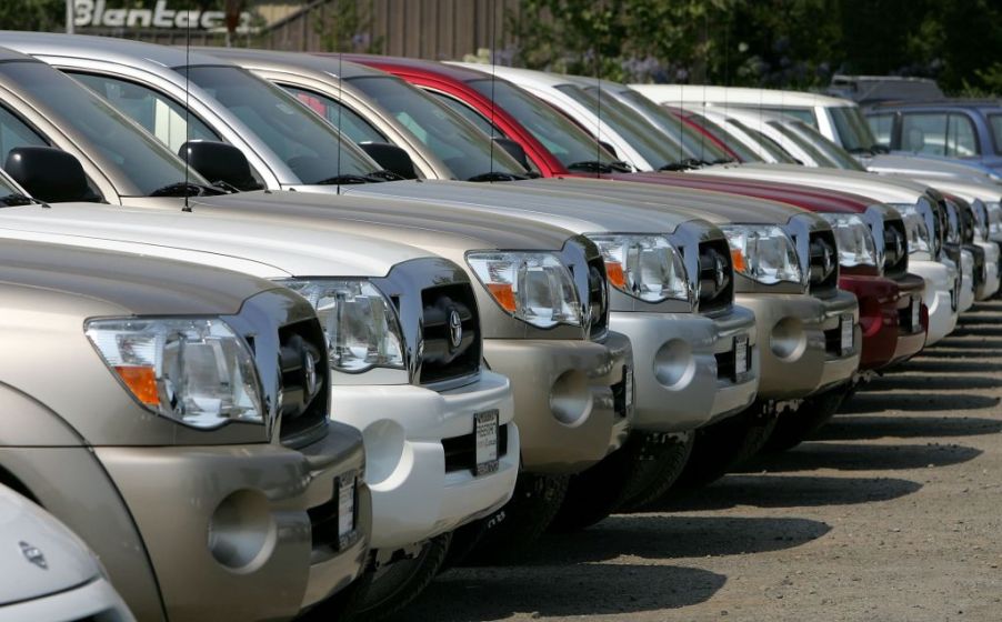 A row of trucks at a dealership.