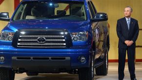 Toyota President Katsuaki Watanabe stands beside a new 2007 Toyota Tundra pickup truck