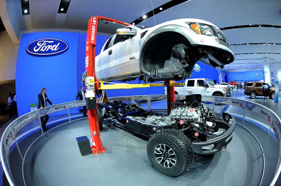 The body of a 2002 Ford F-150 Raptor truck is lifted off its chassis