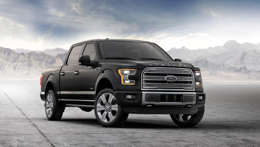 A black 2016 Ford F-150 with a dramtic grey background