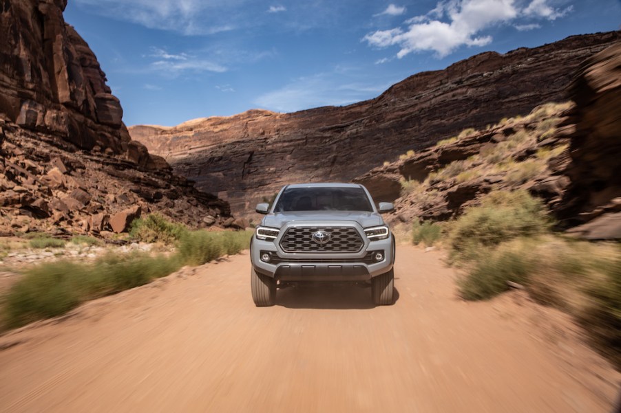 The Toyota Tacoma off-roading on a dirt road