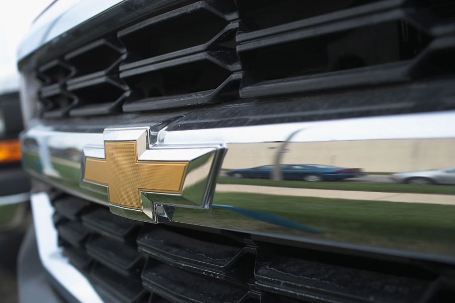 A closeup of a Chevy truck for sale at a dealership