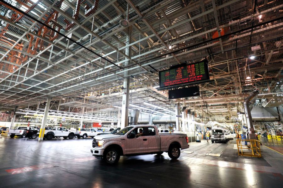 A Ford F-150 truck sitting in a warehouse.