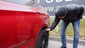 VOLGOGRAD, RUSSIA - NOVEMBER 19, 2016: A client looks at a used car for sale at the AGAT Profi dealership. Dmitry Rogulin/TASS (Photo by Dmitry RogulinTASS via Getty Images)