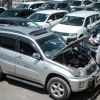 Customers check cars at a used car shop in Nairobi on October 4, 2017. AFP PHOTO / YASUYOSHI CHIBA (Photo credit should read YASUYOSHI CHIBA/AFP via Getty Images)