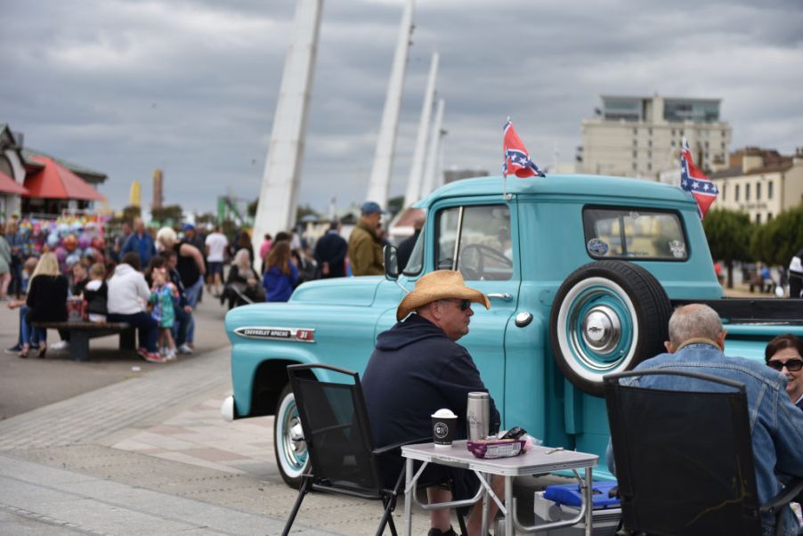 SOUTHEND ON SEA, ENGLAND - JUNE 17: People sit by their Chevrolet Apache 31 American pickup truck during the Southend Classic Car Show along the seafront on June 17, 2018 in Southend on Sea, England. (Photo by John Keeble/Getty Images)