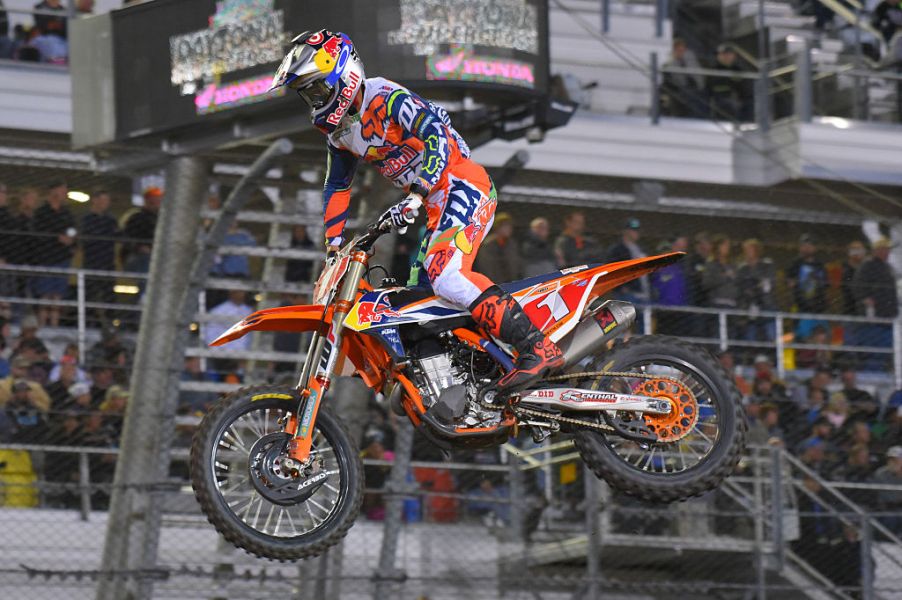 The fastest dirt bike in the world, the KTM 450 SX-F hitting a jump.