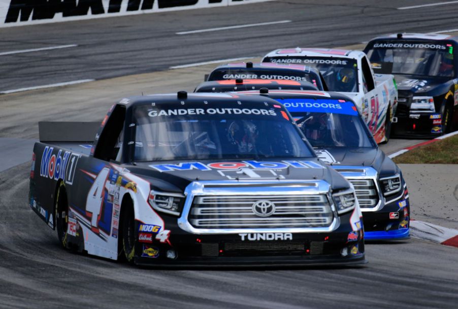 A Toyota Tundra races around the track during a NASCAR truck series event.