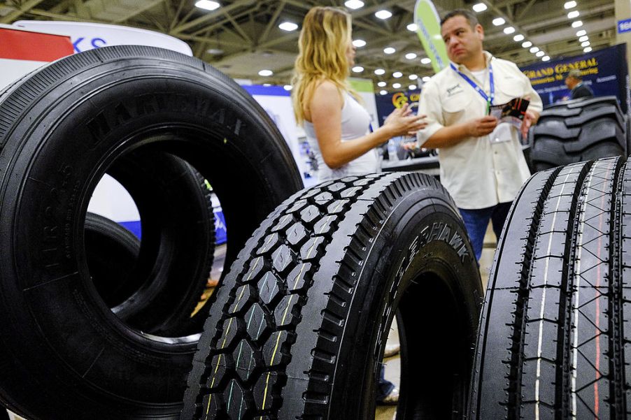 Truck tires sit on display during a car and truck show