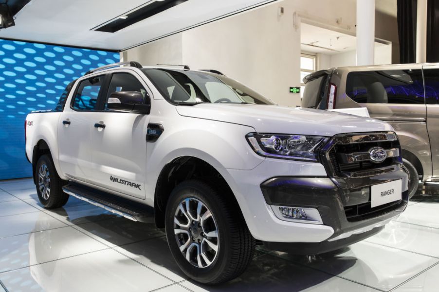 A white Ford Ranger truck on display at an auto show